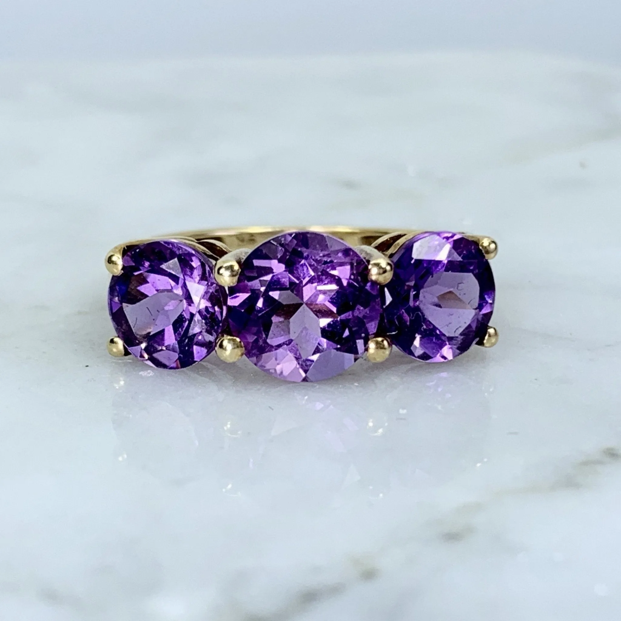 1970s Amethyst Ring with Three Bright Purple Gemstones set in Yellow Gold. February Birthstone.